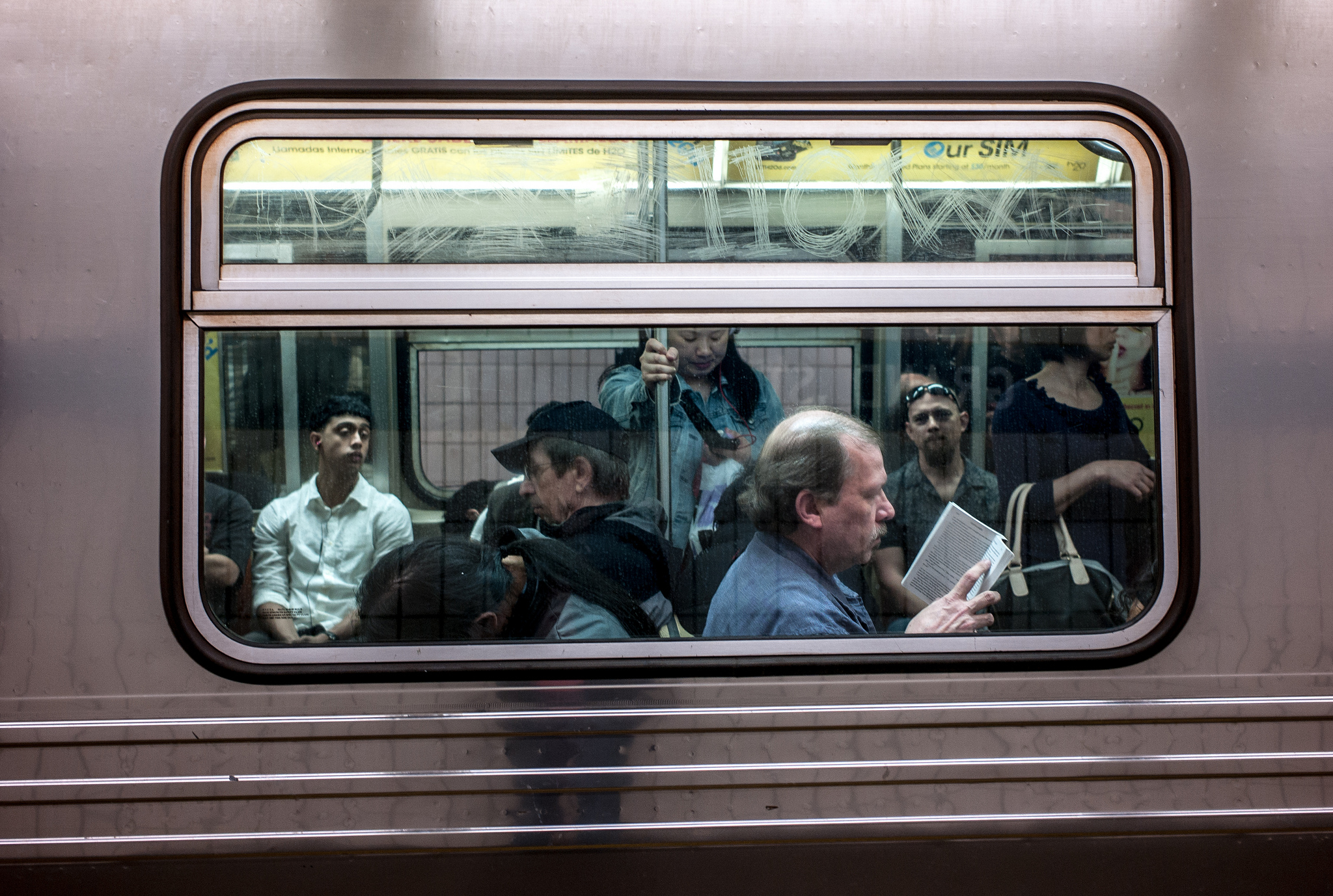 Subway Riders, 2013 CC BY-NC 2.0 Susan Sermoneta